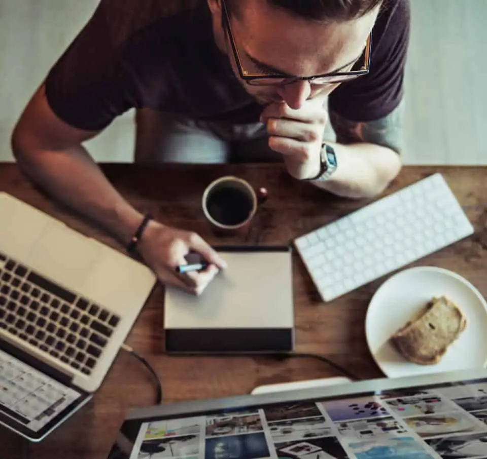 person looking at computer reports