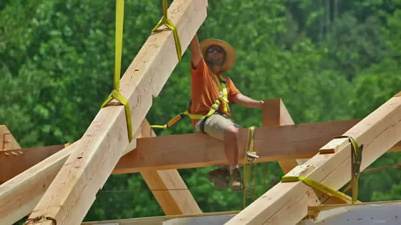 brice cochrane guiding a timber into place