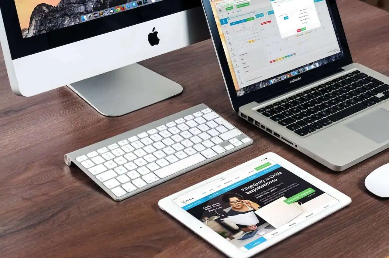 Computer laptop and tablet in a table